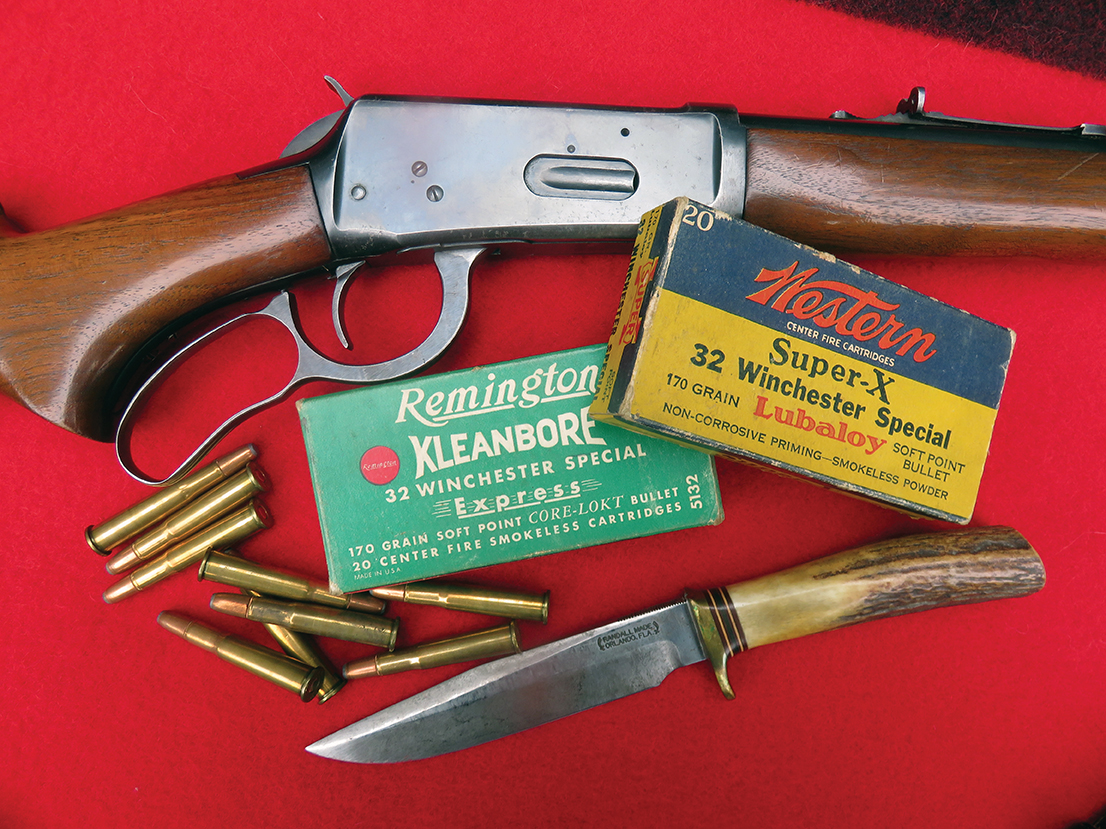 A Winchester Model 64 in 32 Winchester Special shown with some 1950s cartridge boxes.